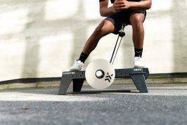 lateral squat on kBox Lite with M flywheel and platform extension foot block in an outdoor setting