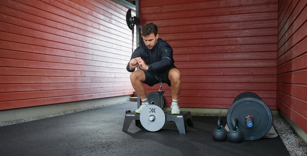 Squat on a kBox in a garage gym