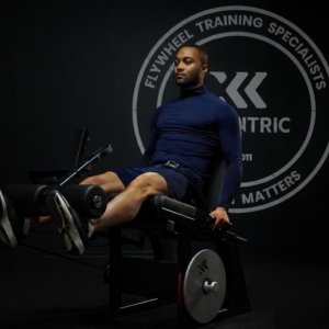 Man doing leg extensions on LegExx